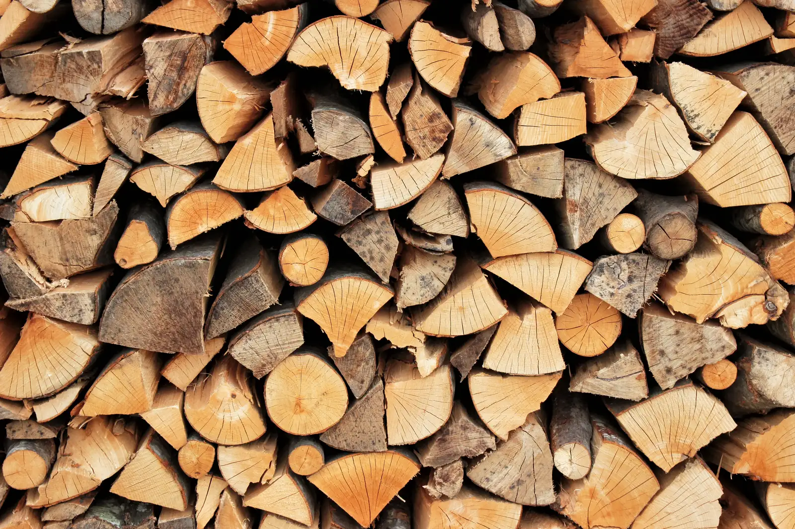 Split seasoned hardwood firewood logs stacked for sale in Pontypool